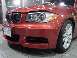 Vancouver-ClearBra-2009-BMW-135i-red-Xpel-Ultimate-Paint-Protection-Film-Brian-Jessel-BMW-finished-bumper-wrap