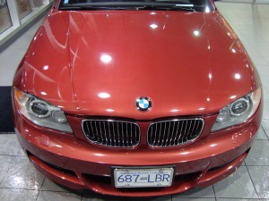 Vancouver-ClearBra-2009-BMW-135i-red-Xpel-Ultimate-Paint-Protection-Film-Brian-Jessel-BMW-finished-hood-24-inch